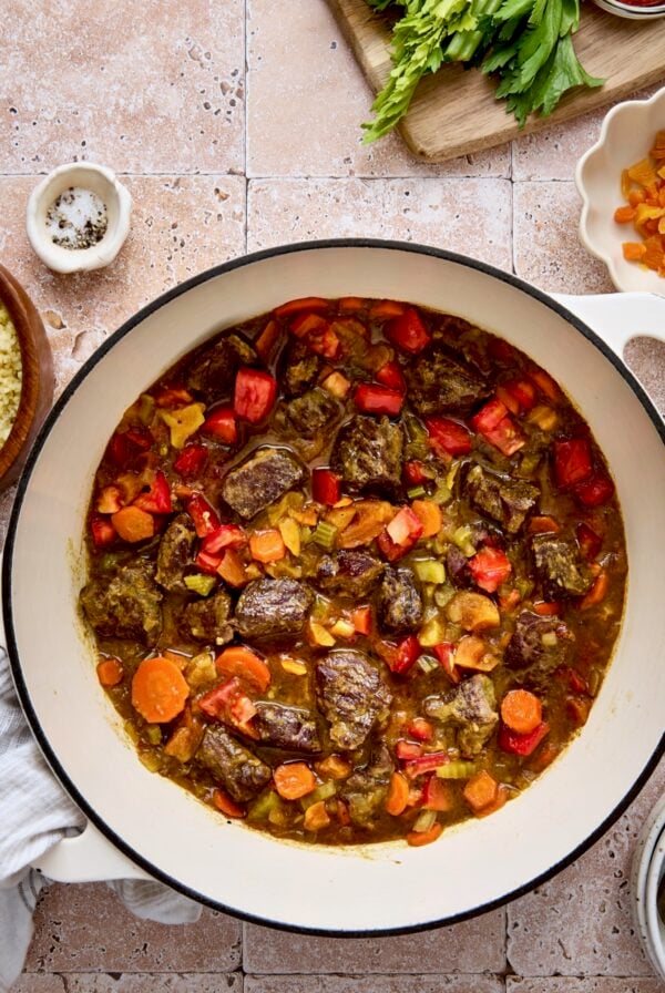Moroccan Beef Stew in white enamel Dutch oven.